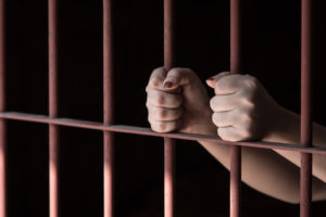 Woman hand in jail